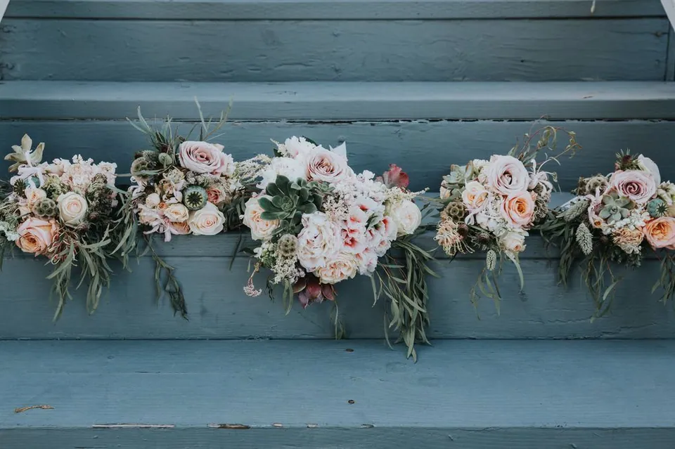 Long floral runner with pale blush and white flowers.